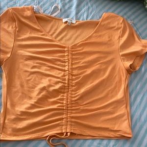 This is a draw string belly shirt